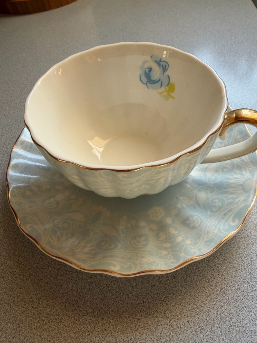 Porcelain Teacup and Saucer Set in Blue with Gold Trim